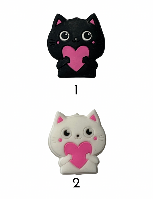 Cat holding pink heart