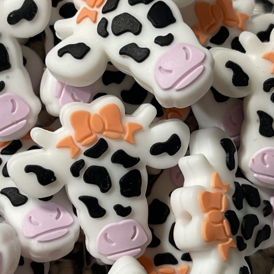 Cow white with orange bow
